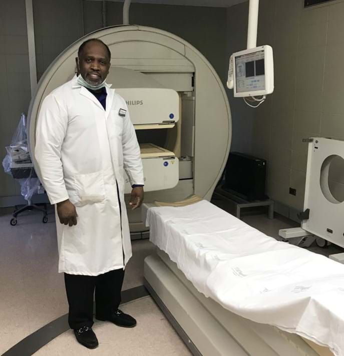 Doctor staning with imaging equipment