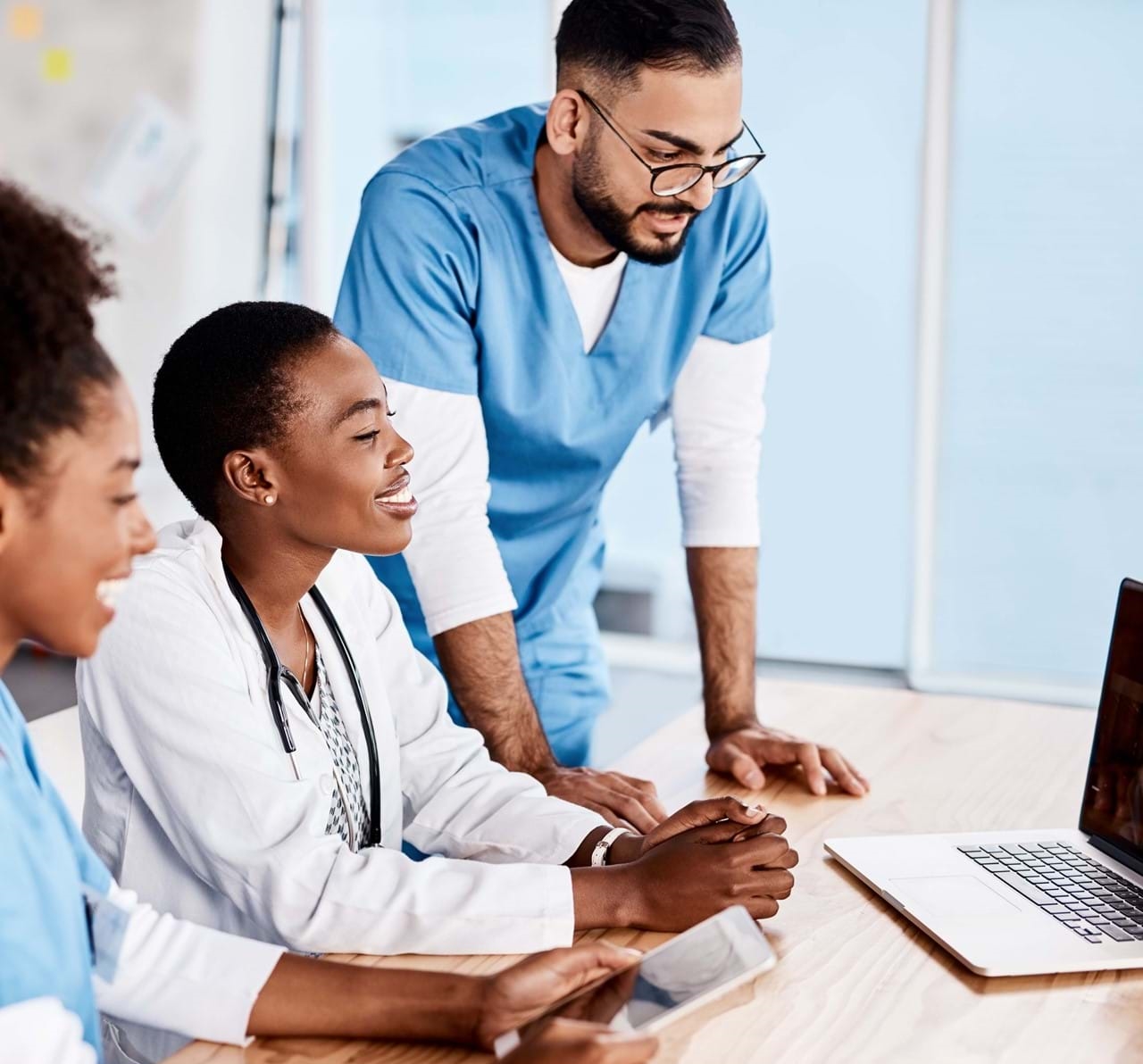 medical professionals using laptop