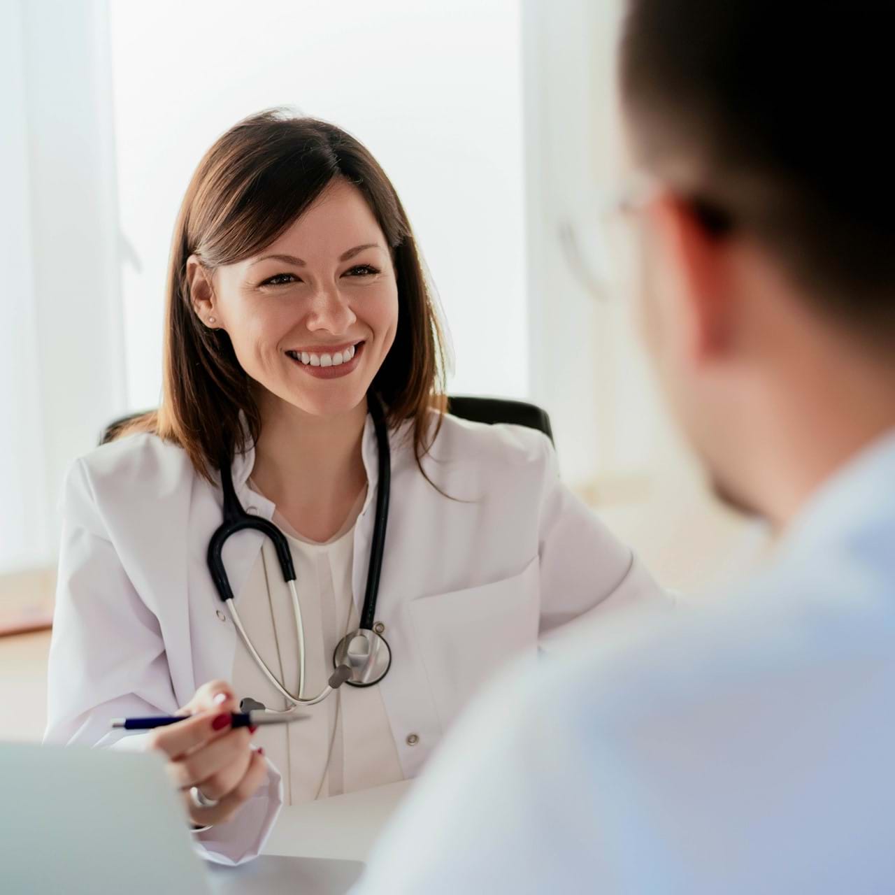 Doctor smiling at patient