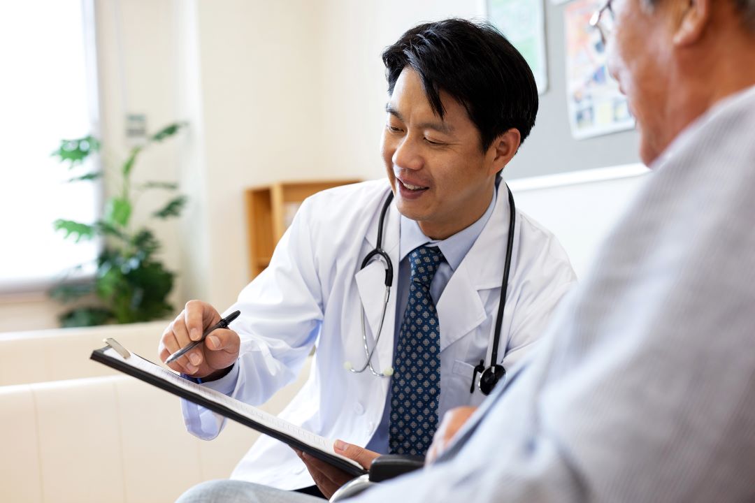 Doctor showing patient information on clipboard