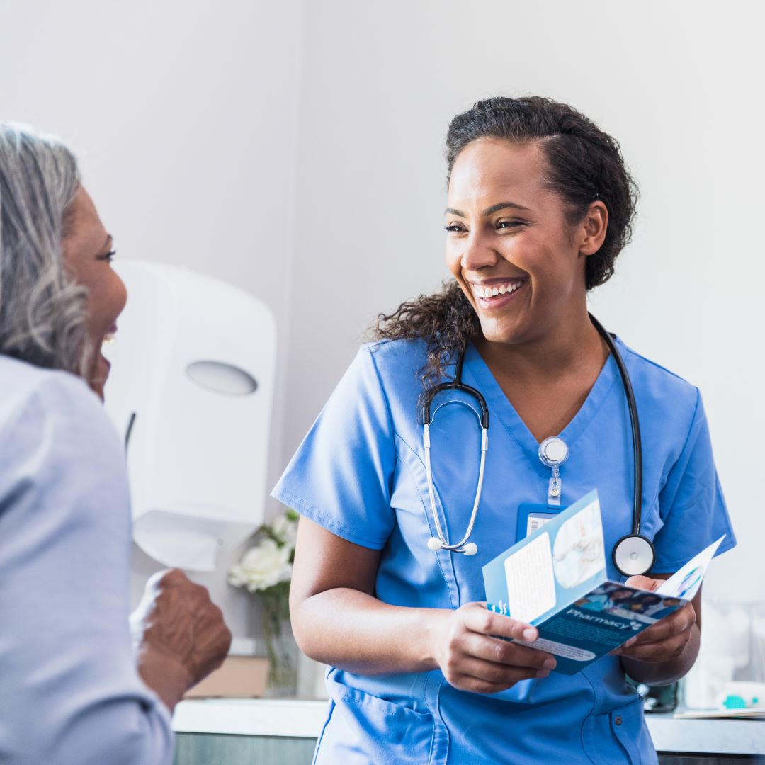 Nurse and patient sharing a laugh