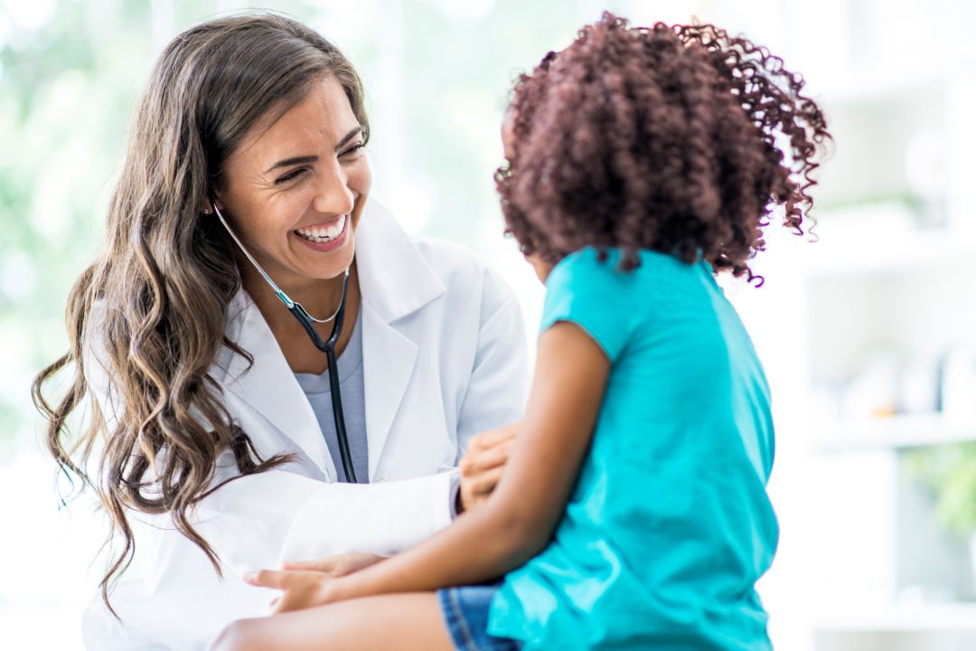 Doctor smiling at child