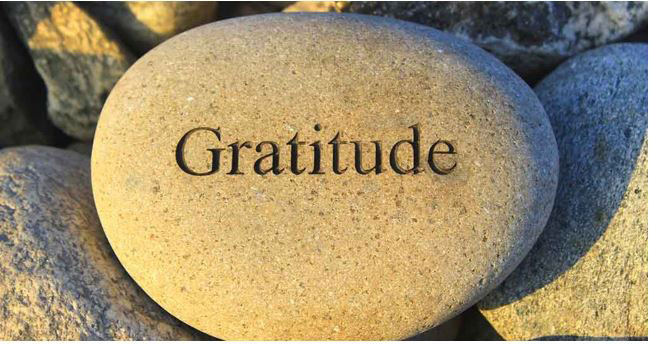 Gratitude written on a rock
