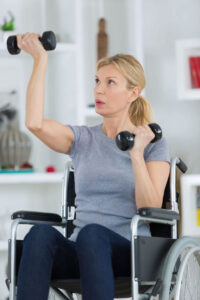 woman in wheelchair with weights
